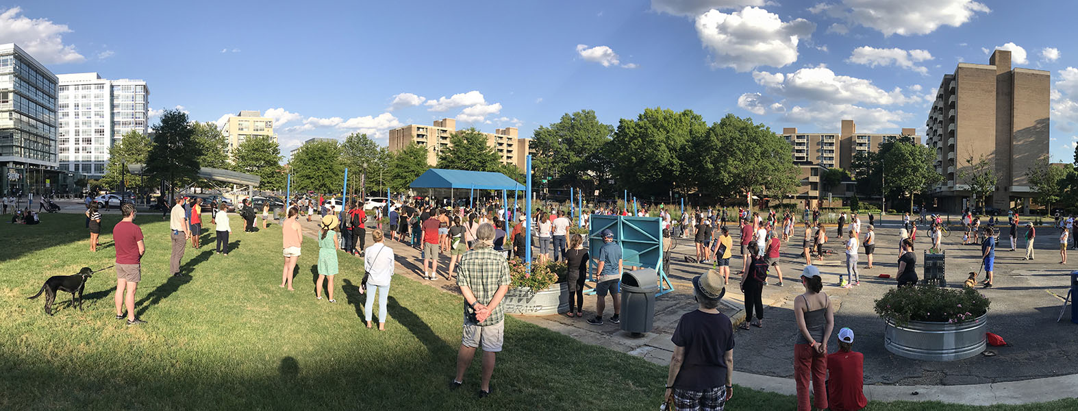 Socially Distanced Crowd in Sunny Urban Open Area.